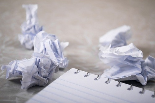 crumpled up paper during draft writing process