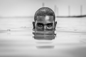 man with head above water