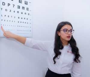 optometrist conducting eye testing