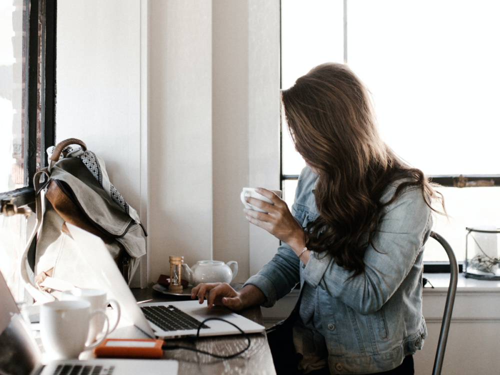 Woman blogging on her laptop